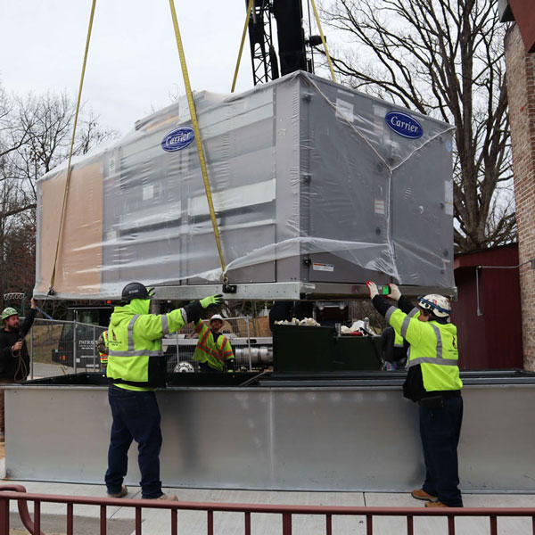 Harvey Hottel Contractors Unloading an HVAC Unit in the DC Metropolitan Area