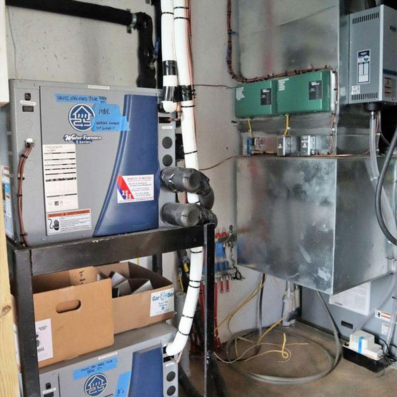 Room with furnace and HVAC system, highlighting commercial plumbing in the DC Metropolitan Area.